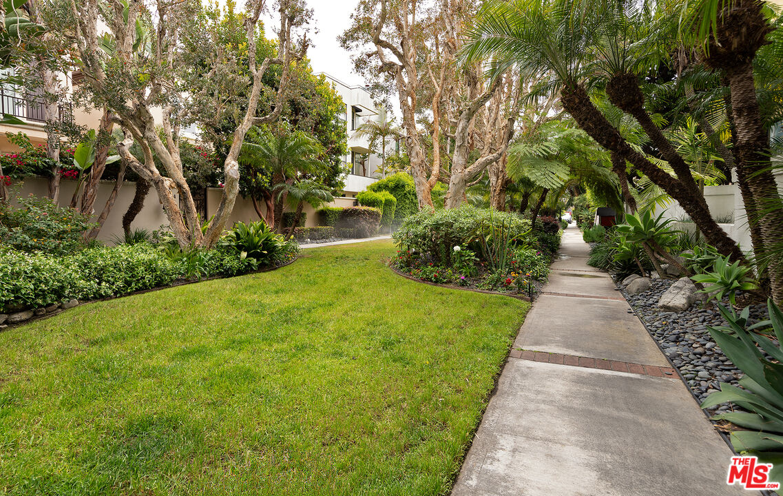 4350 Vía Dolce, Unit 105 Marina del Rey, CA 90292 - Photo 27 of 31 a view of a pathway with a yard