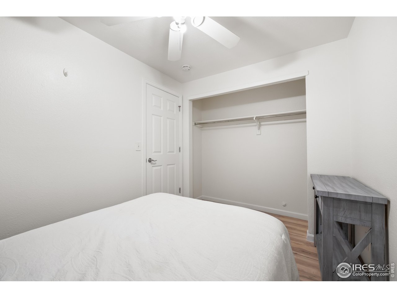 1405 Broadway, Unit 101 Boulder, CO 80302 - Photo 11 of 22 a bedroom with a bed and a fireplace