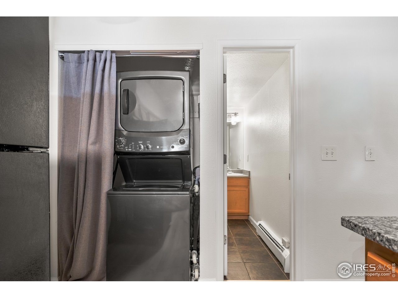 1405 Broadway, Unit 101 Boulder, CO 80302 - Photo 12 of 22 a view of a kitchen from the hallway