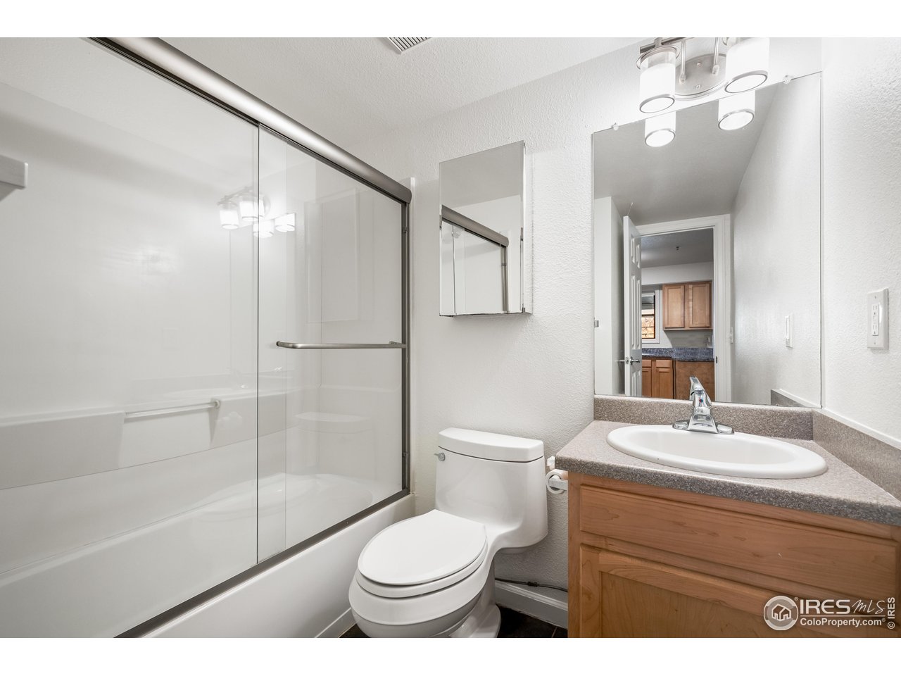 1405 Broadway, Unit 101 Boulder, CO 80302 - Photo 13 of 22 a bathroom with a sink toilet and shower