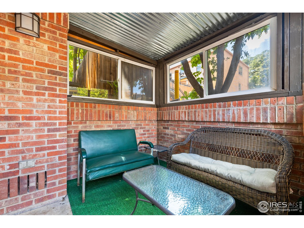 1405 Broadway, Unit 101 Boulder, CO 80302 - Photo 6 of 22 a living room with furniture