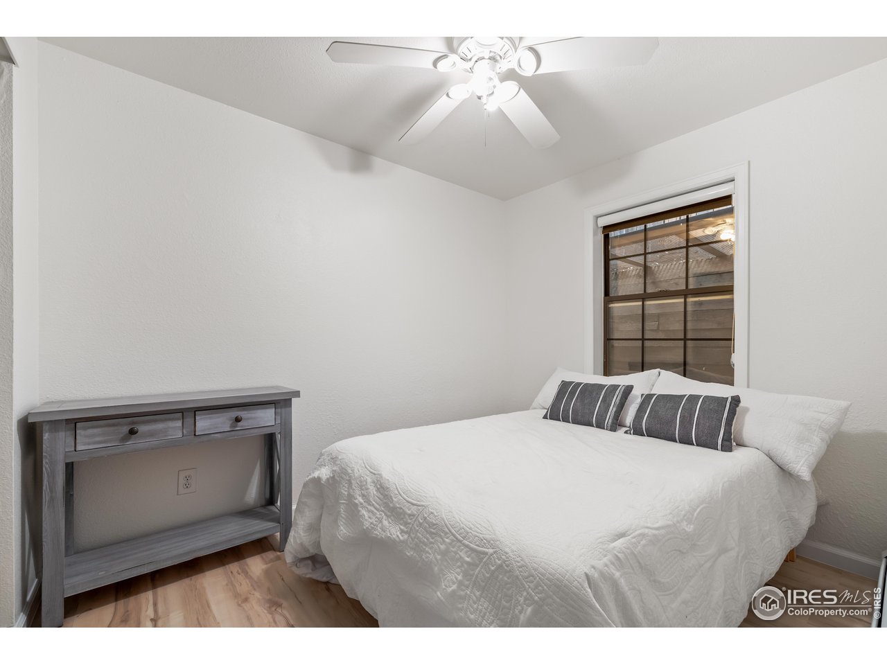 1405 Broadway, Unit 101 Boulder, CO 80302 - Photo 10 of 22 a bedroom with a bed and a window