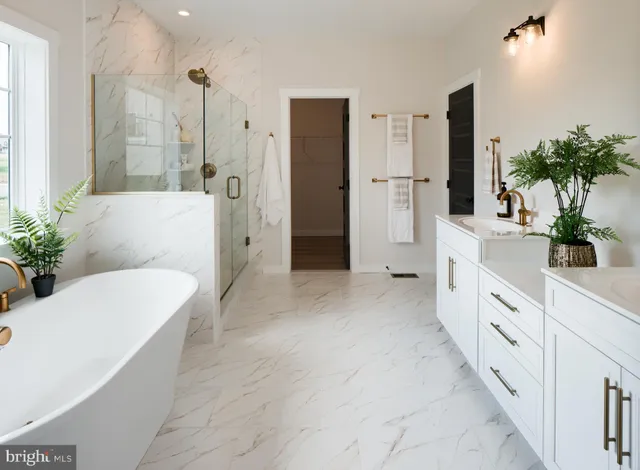 a large white kitchen with a large tub and shower