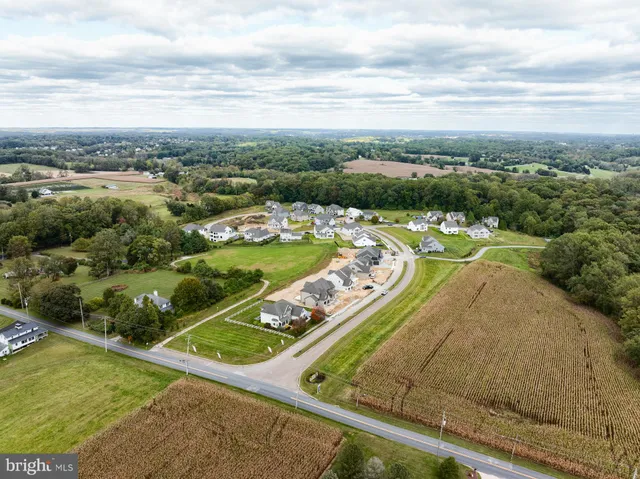 an aerial view of a house with outdoor space