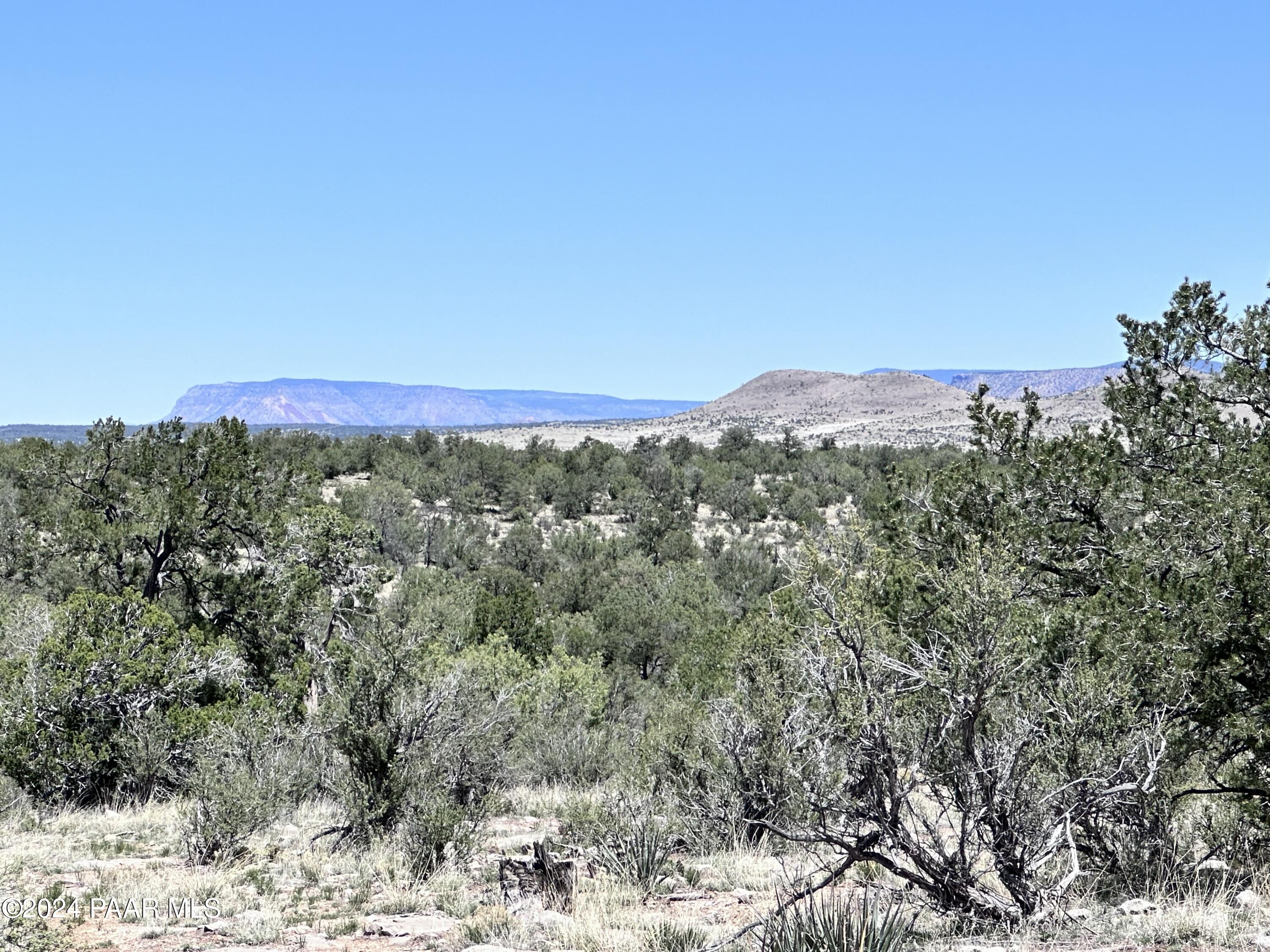 K North Peaceful Hill Road Seligman, AZ 86337 - Photo 14 of 18 a view of a city with mountains in the background