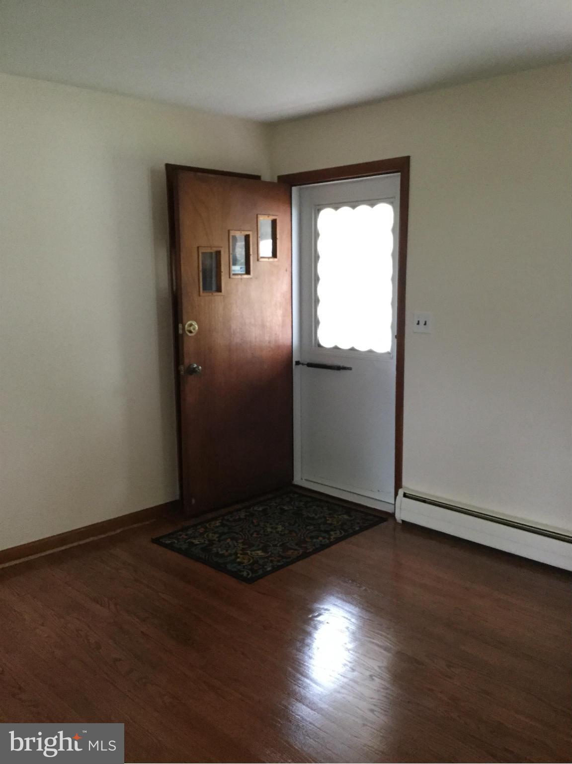 3457 Ebenezer Road Fallston, MD 21047 - Photo 4 of 24 an empty room with wooden floor and windows