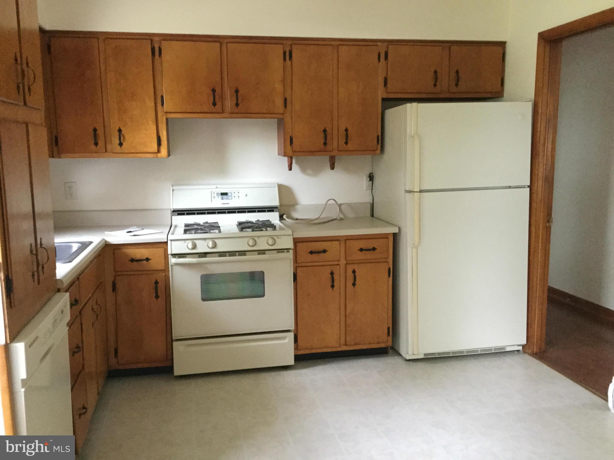 3457 Ebenezer Road Fallston, MD 21047 - Photo 8 of 24 a kitchen with a stove a refrigerator and a sink