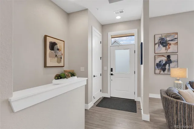 a room with furniture and wooden floor