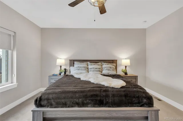 a bedroom with a bed and window