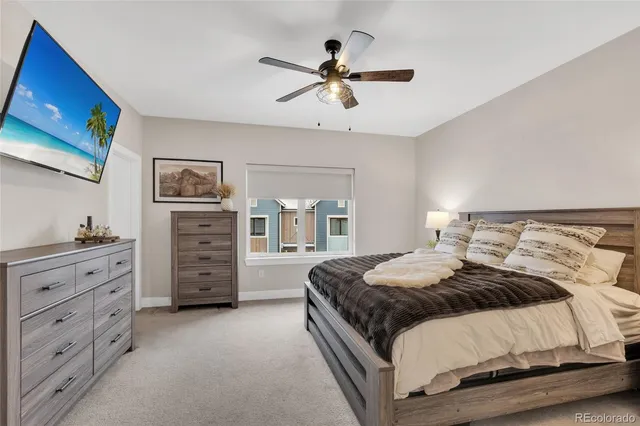 a spacious bedroom with a bed and window