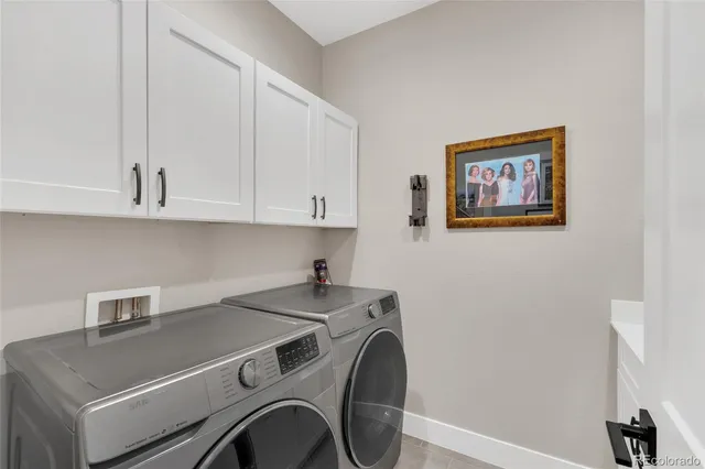 a view of storage and utility room with washer and dryer