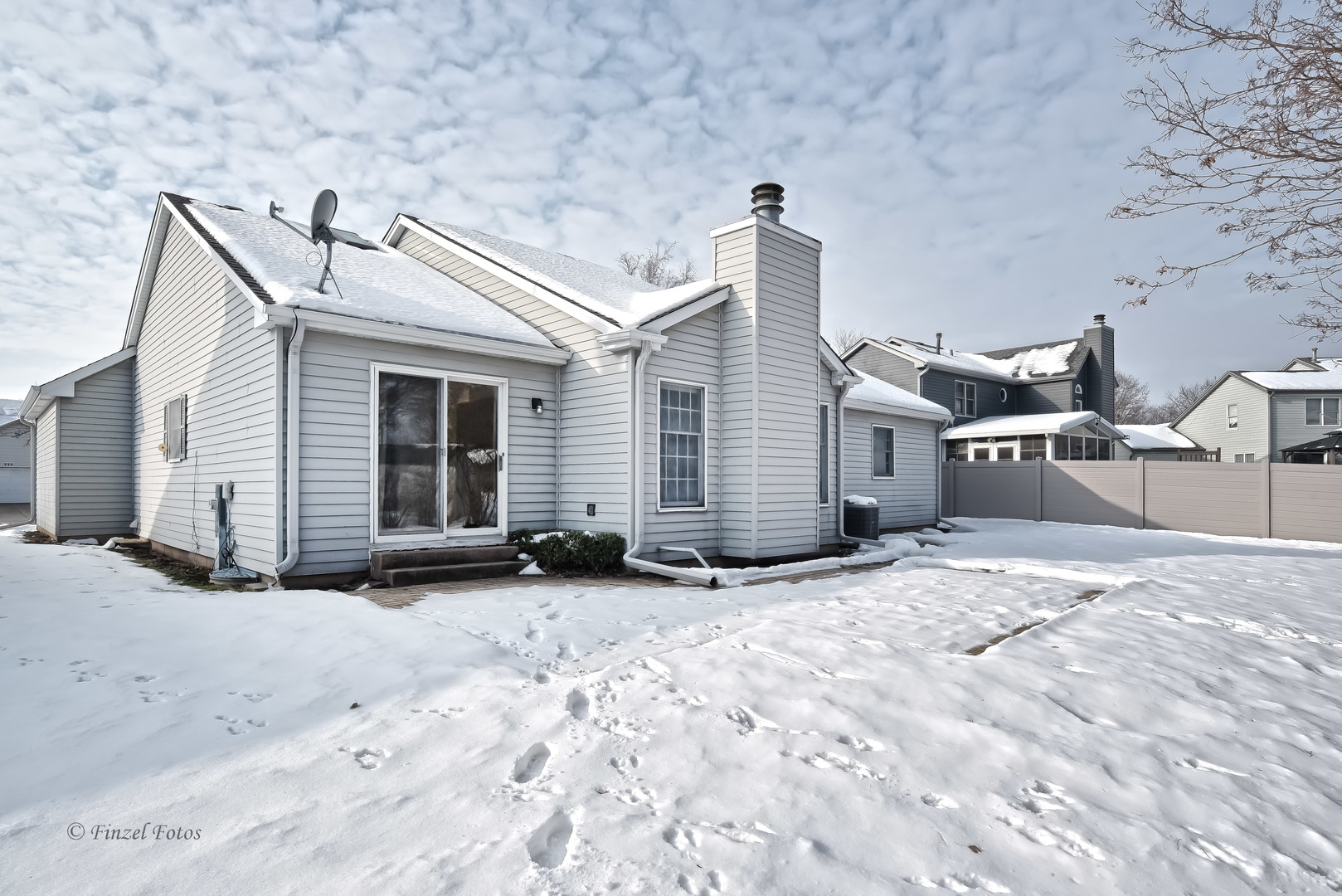 691 Canyon Lane Elgin, IL 60123 - Photo 17 of 17 a view of a house with a snow in the yard