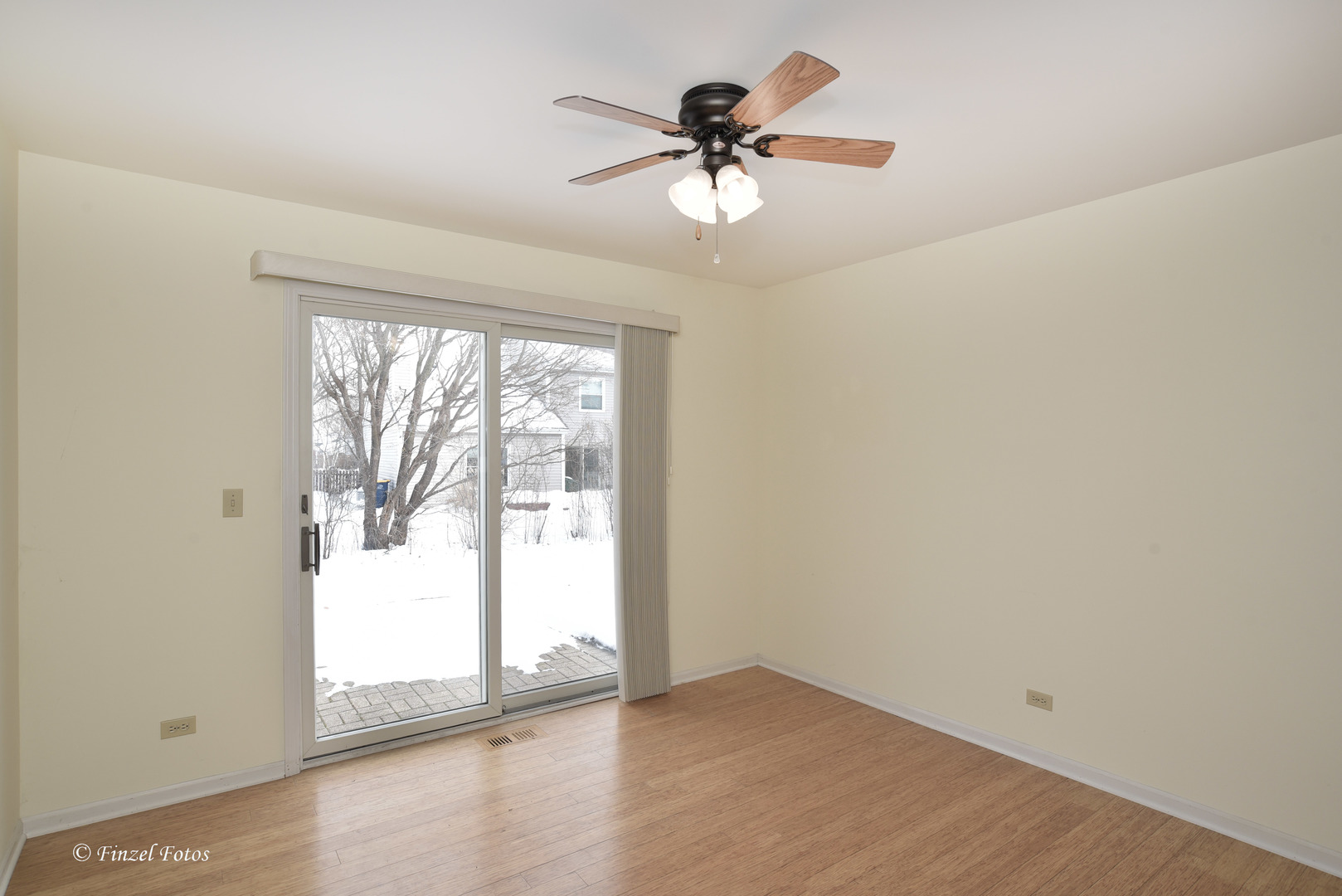 691 Canyon Lane Elgin, IL 60123 - Photo 7 of 17 an empty room with wooden floor and windows