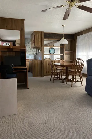 a dining room with furniture and a fireplace