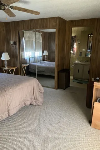 a en suite bathroom with a sink and a mirror