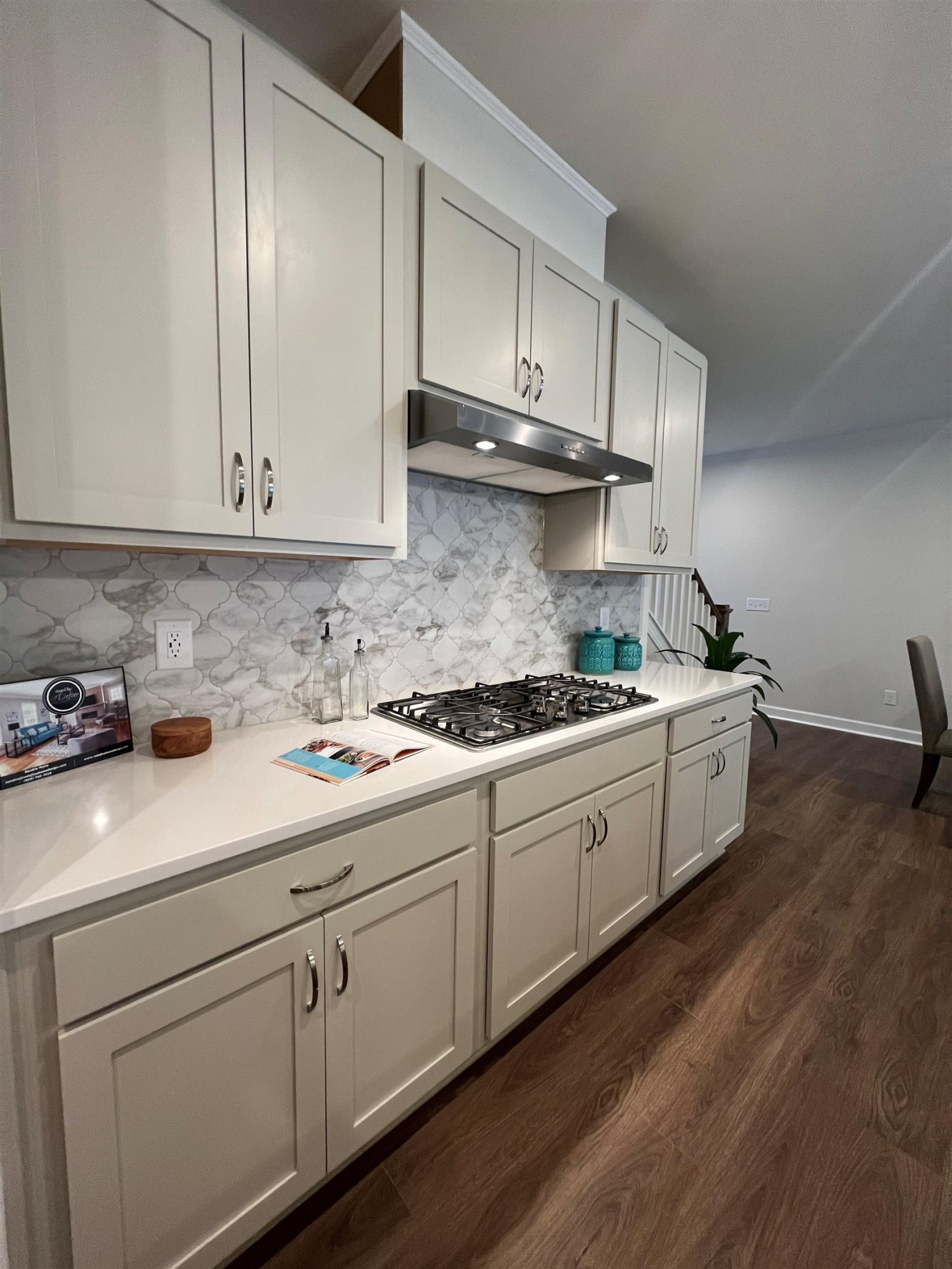 7908 Sofiana Avenue Raleigh, NC 27617 - Photo 11 of 26 a kitchen with stainless steel appliances granite countertop a sink a stove and cabinets