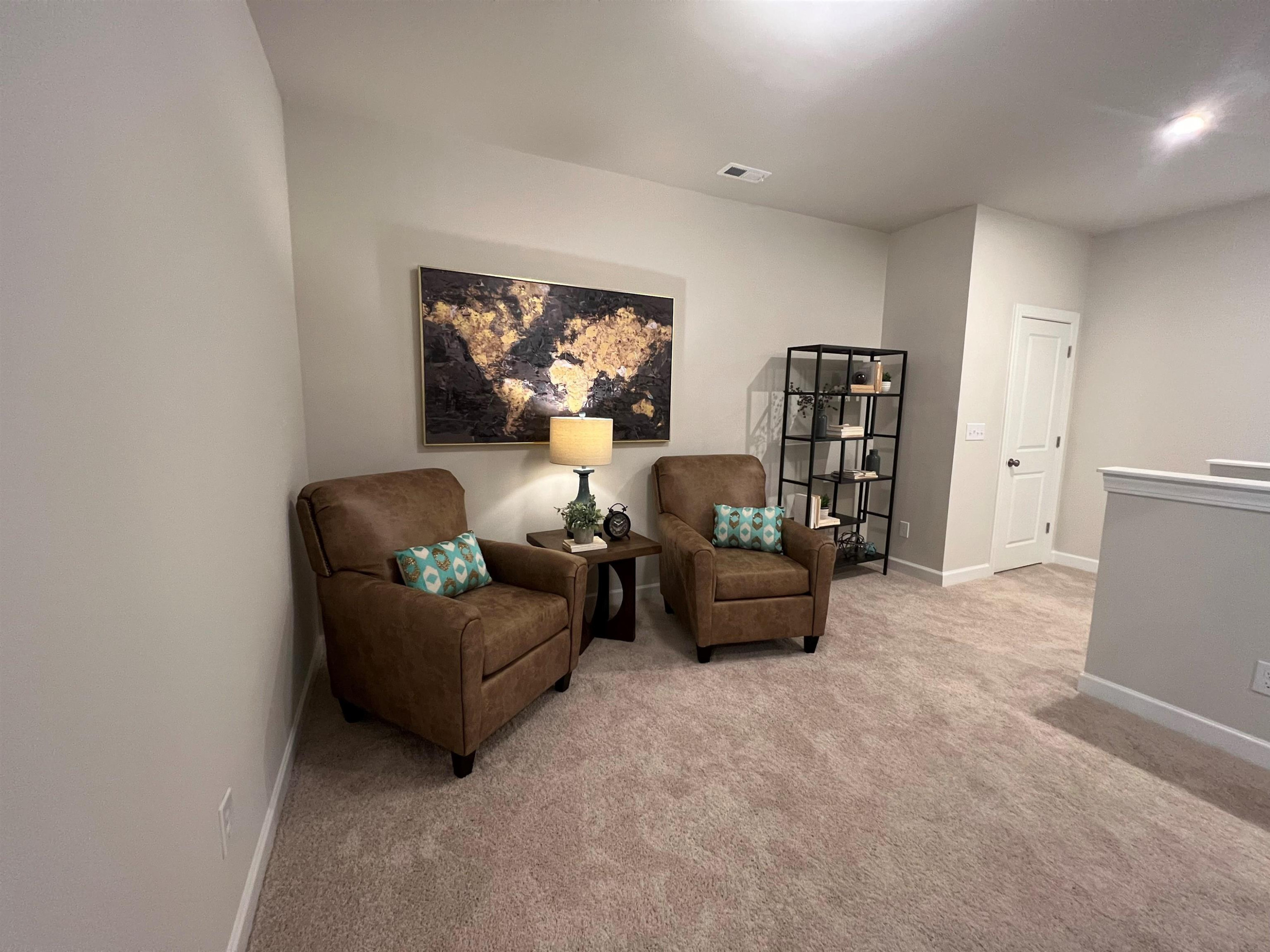7908 Sofiana Avenue Raleigh, NC 27617 - Photo 15 of 26 a living room with furniture and a flat screen tv