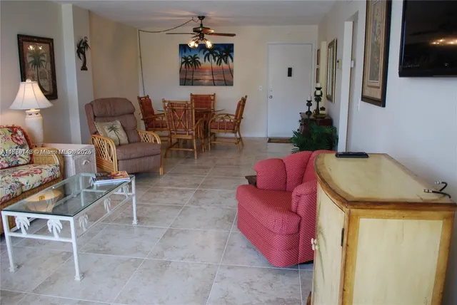 a view of a hallway with paintings on the wall