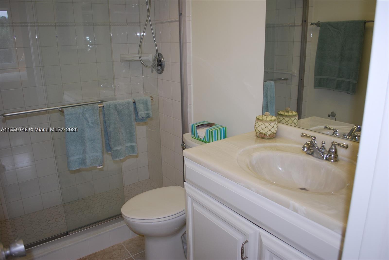 125 South Ocean Avenue, Unit 214 Palm Beach Shores, FL 33404 - Photo 16 of 26 a bathroom with a sink toilet and shower