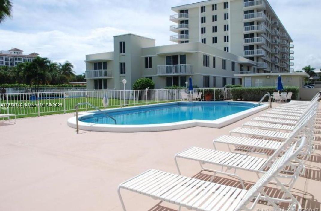 125 South Ocean Avenue, Unit 214 Palm Beach Shores, FL 33404 - Photo 18 of 26 a view of a house with a swimming pool