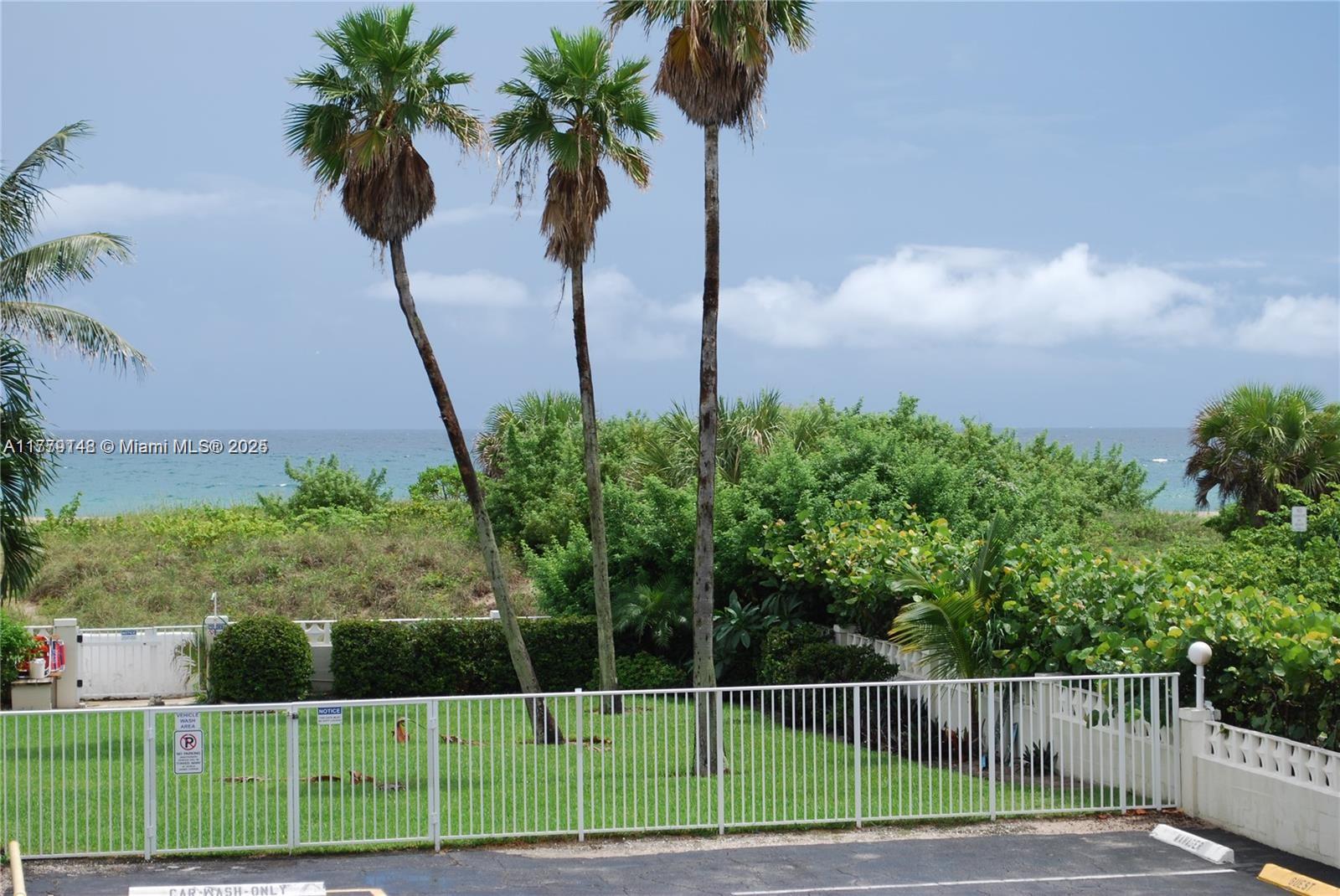 125 South Ocean Avenue, Unit 214 Palm Beach Shores, FL 33404 - Photo 22 of 26 a view of a garden with a palm tree