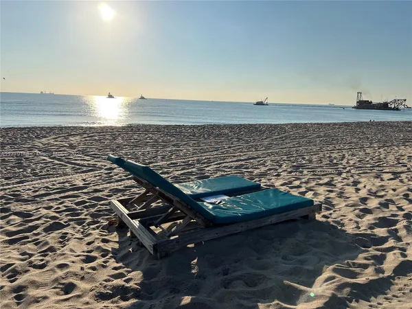 a view of a balcony with yard