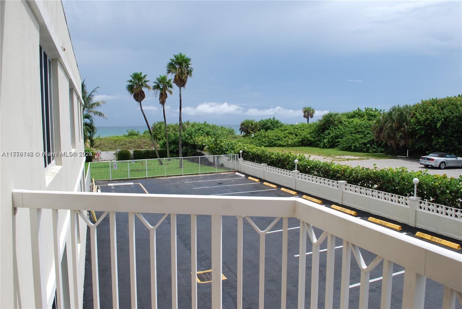 125 South Ocean Avenue, Unit 214 Palm Beach Shores, FL 33404 - Photo 8 of 26 a view of a balcony with yard