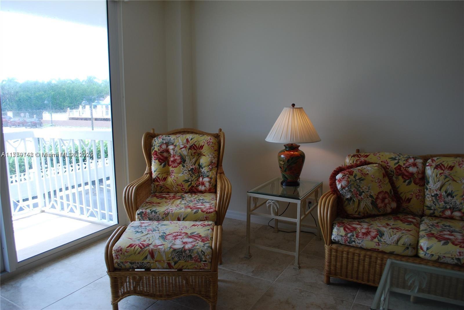 125 South Ocean Avenue, Unit 214 Palm Beach Shores, FL 33404 - Photo 10 of 26 a bedroom with furniture and a window