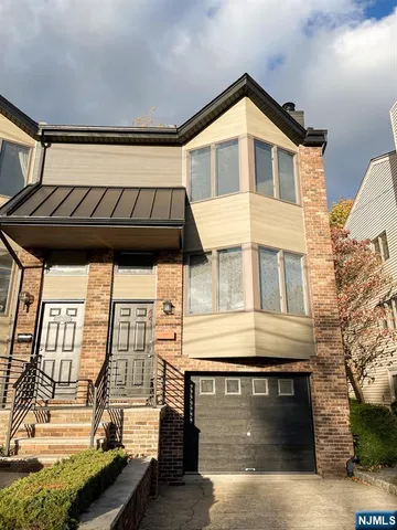 a view of a house with a balcony and stairs