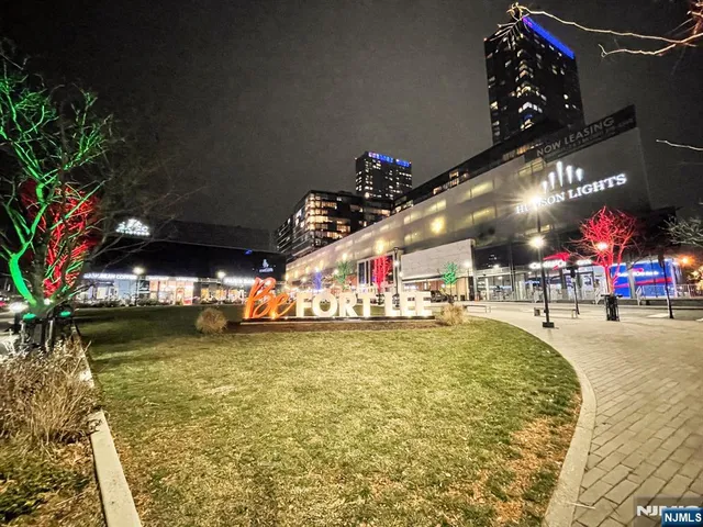 a view of a swimming pool with an outdoor space and seating area