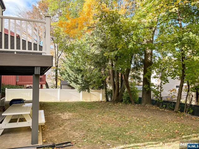 a view of a street with a sign on the wall