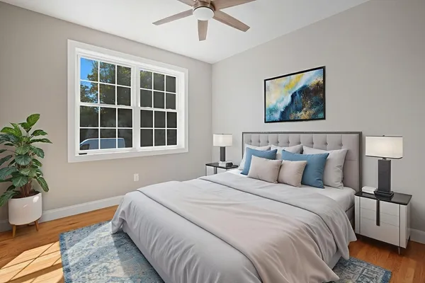 a bedroom with bed and a window