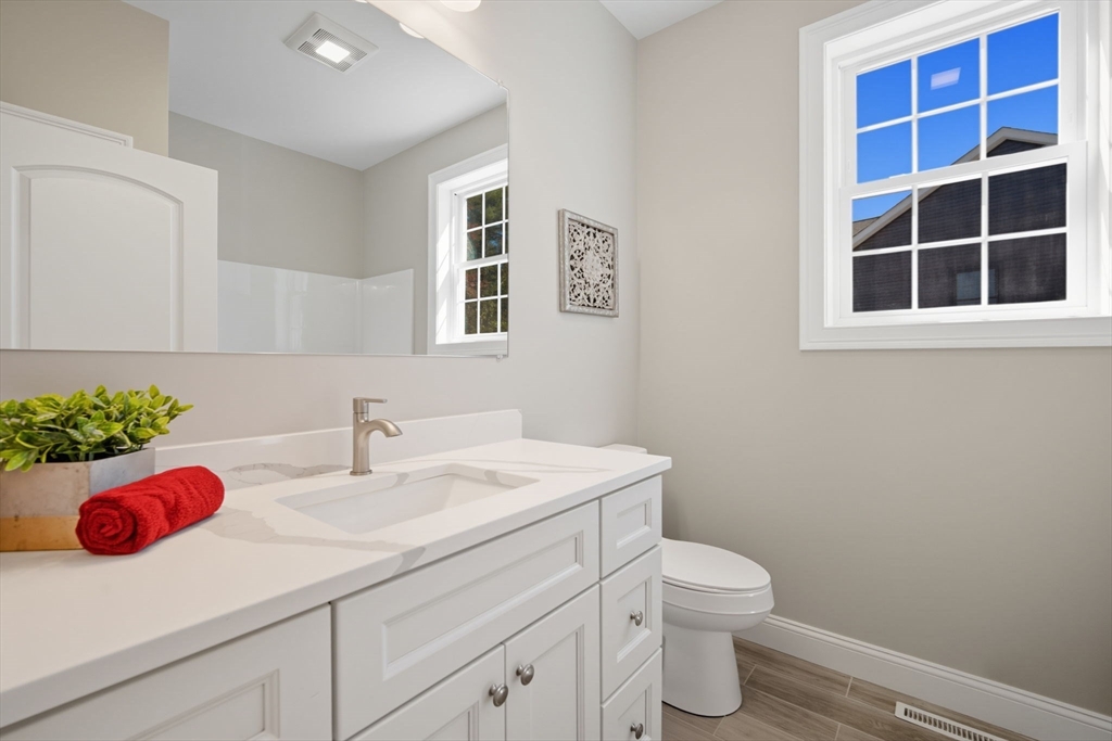 31 High Blf Road Belchertown, MA 01007 - Photo 25 of 36 a bathroom with a sink a toilet and a window