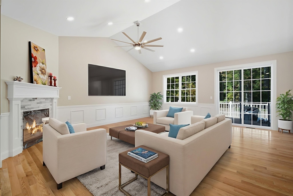 31 High Blf Road Belchertown, MA 01007 - Photo 4 of 36 a living room with furniture a fireplace and a flat screen tv