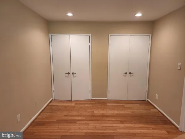 a view of room with wooden floor