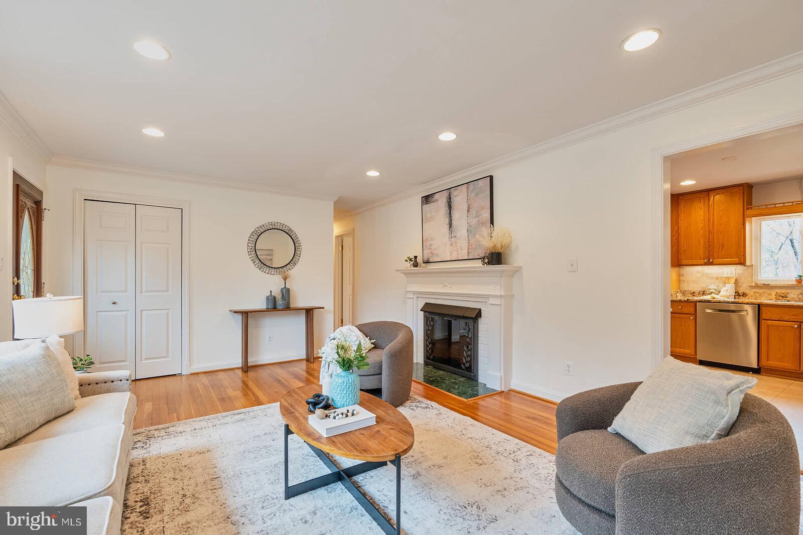 1912 Pagebrook Road Silver Spring, MD 20903 - Photo 5 of 52 a living room with furniture and a fireplace