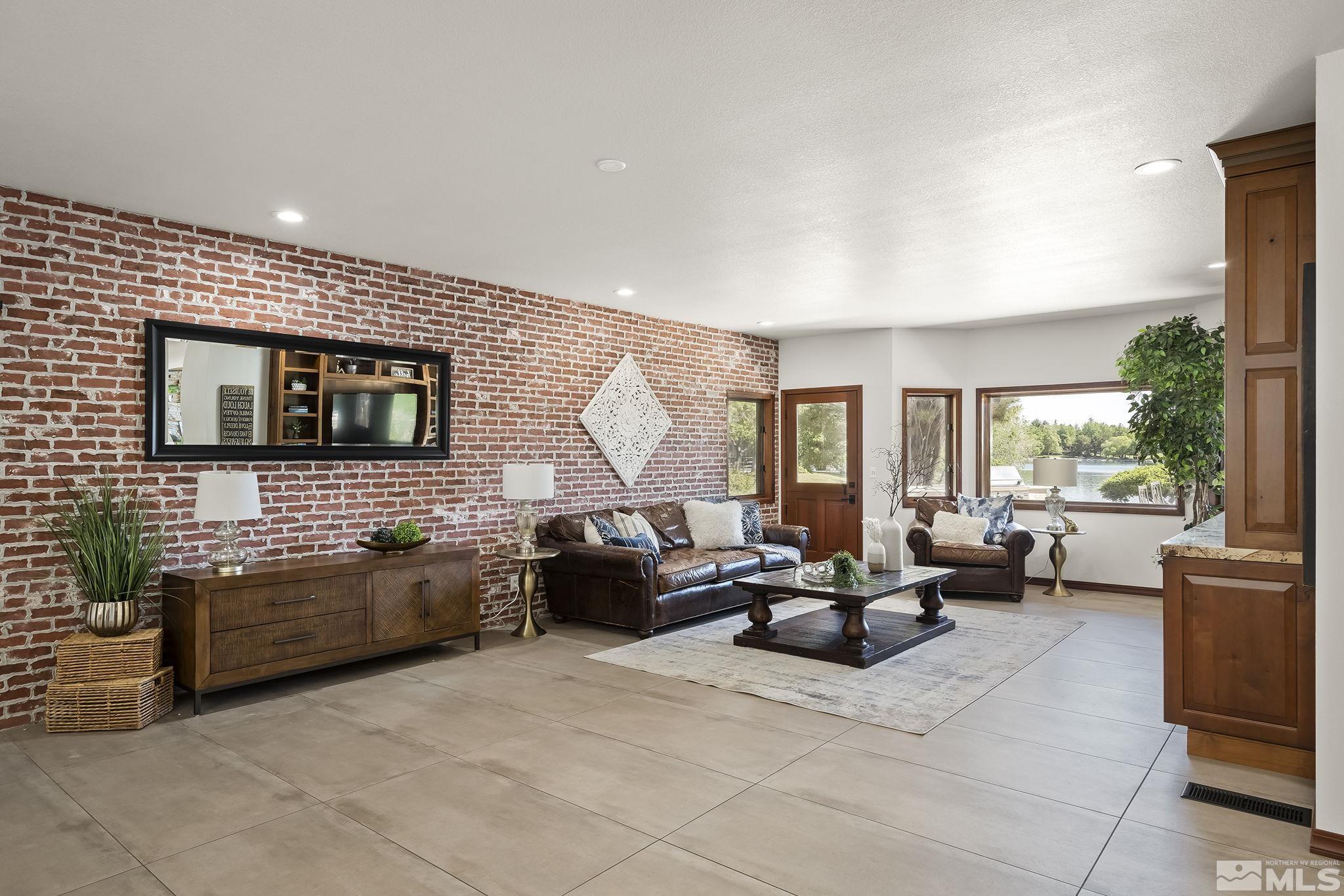 2800 East Lake Ridge Reno, NV 89519 - Photo 12 of 40 a living room with furniture and a flat screen tv