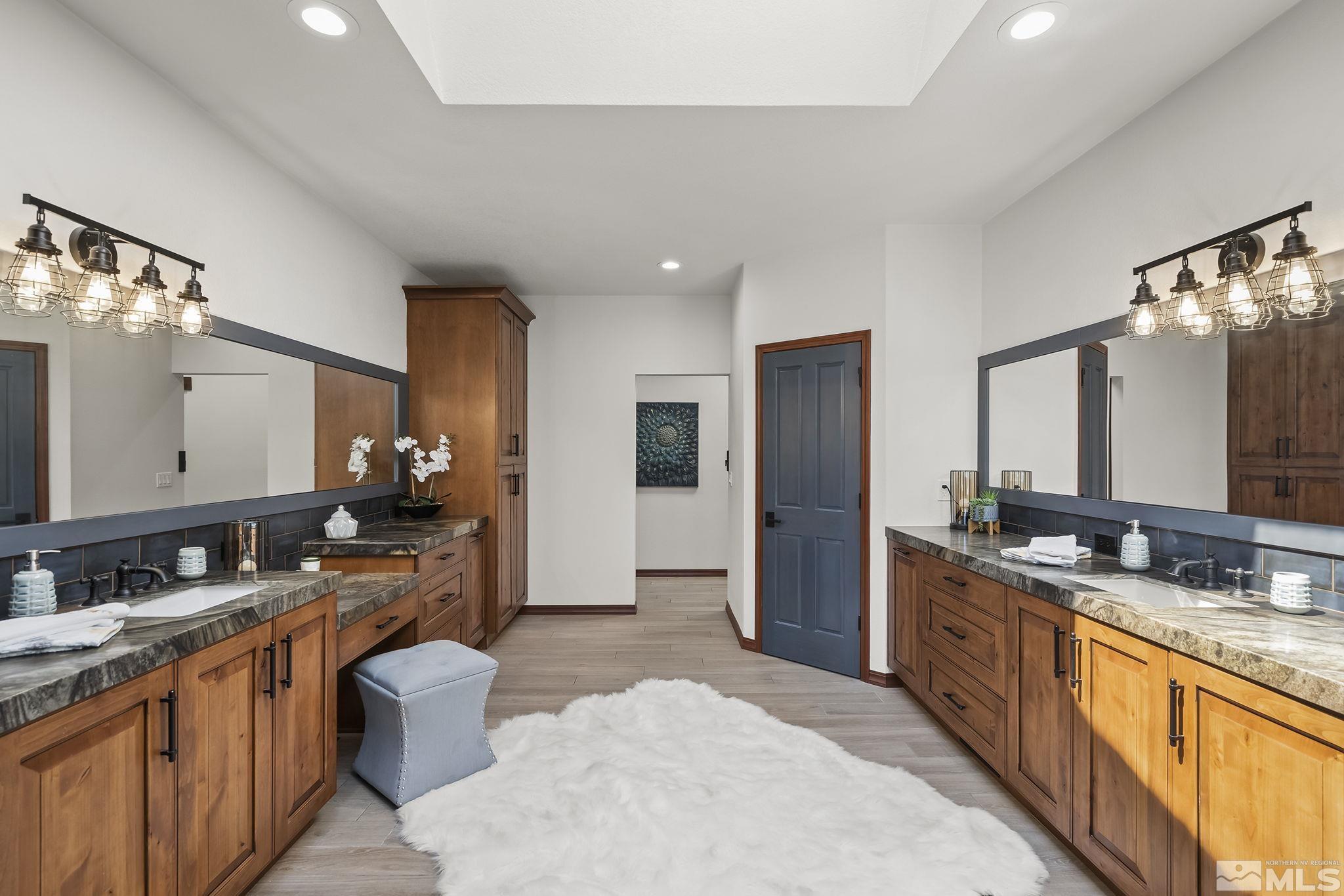 2800 East Lake Ridge Reno, NV 89519 - Photo 24 of 40 a large bathroom with double vanity and a large mirror or sink