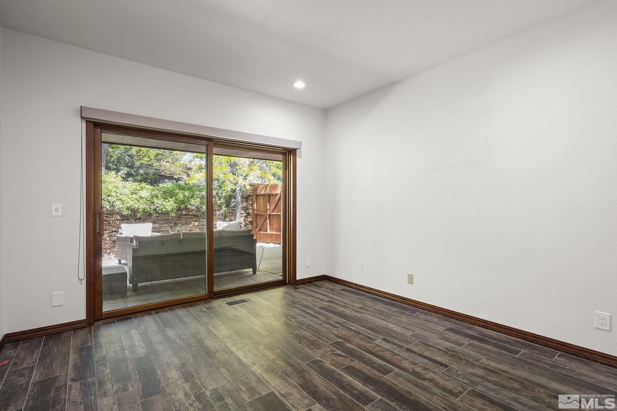 2800 East Lake Ridge Reno, NV 89519 - Photo 29 of 40 wooden floor in an empty room with a window