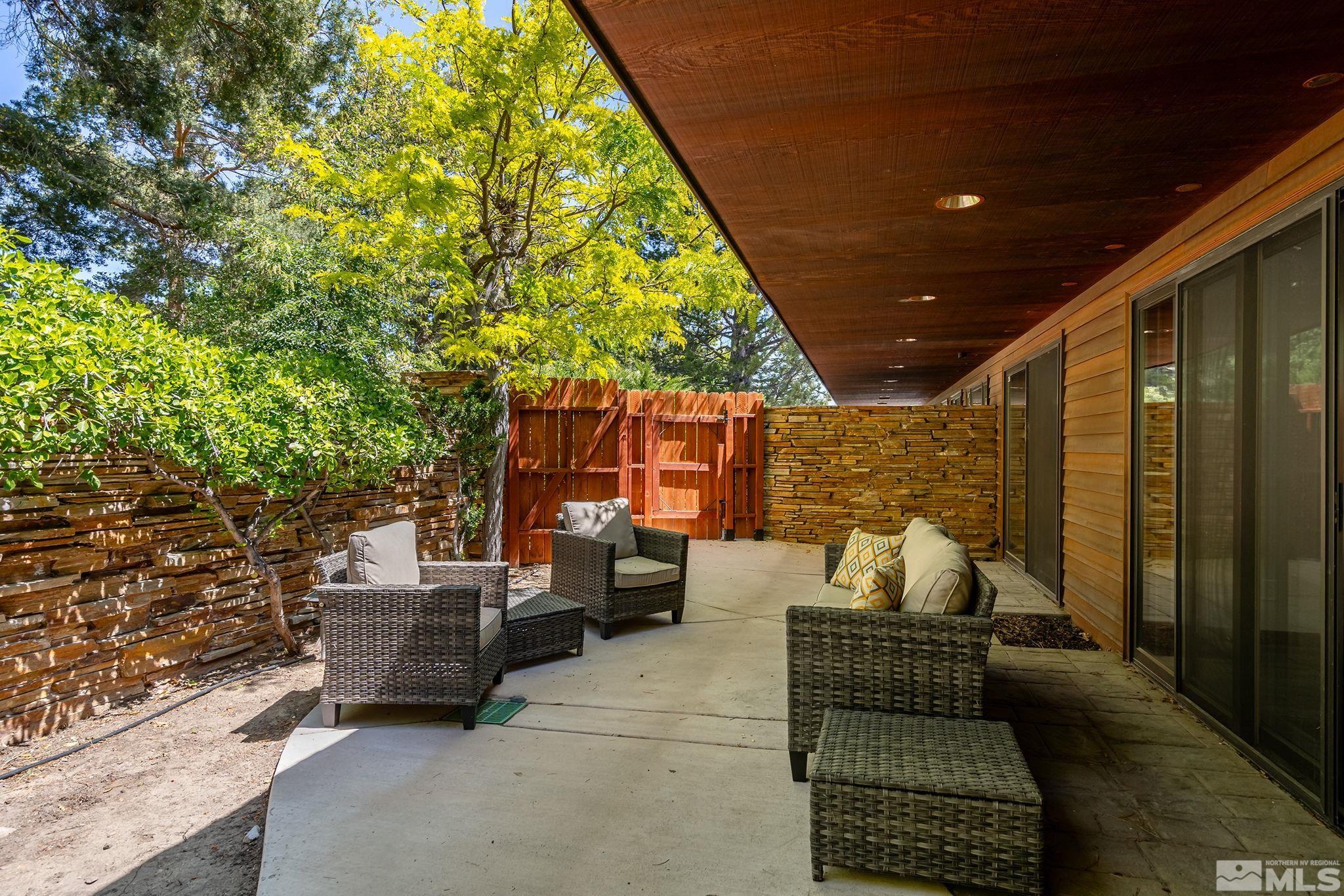 2800 East Lake Ridge Reno, NV 89519 - Photo 32 of 40 a outdoor living space with patio furniture and a potted plant