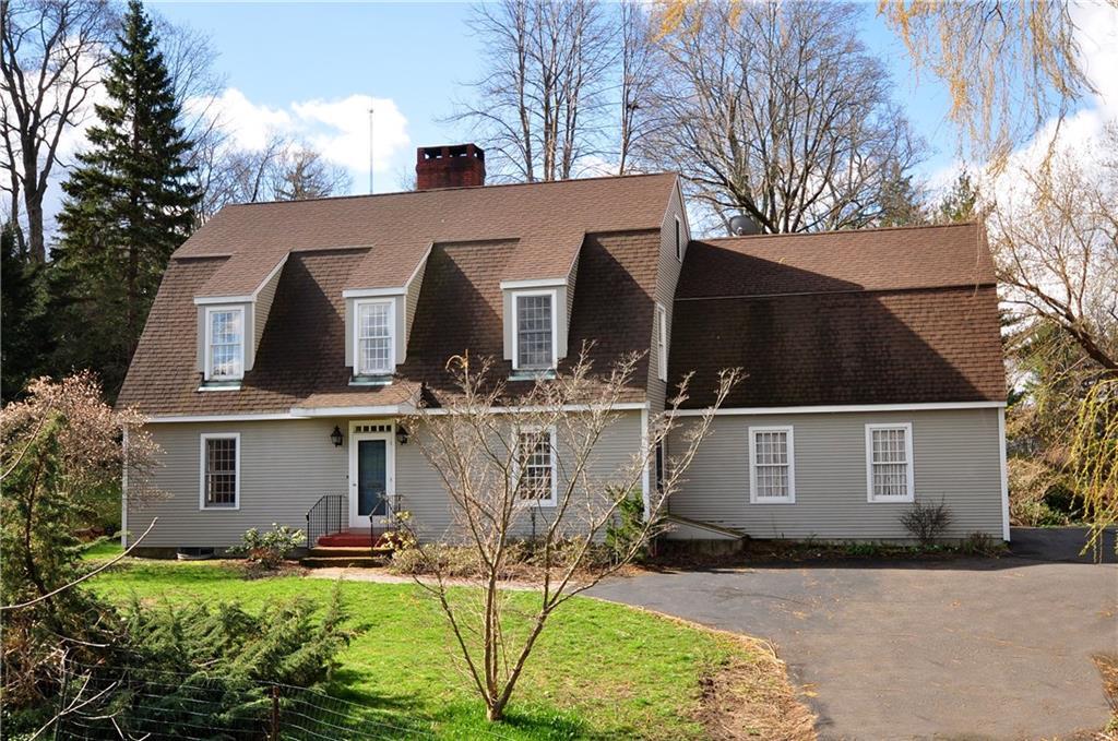 5 Maple Street Farmington, CT 06032 - Photo 1 of 1 a front view of house with yard and trees in the background