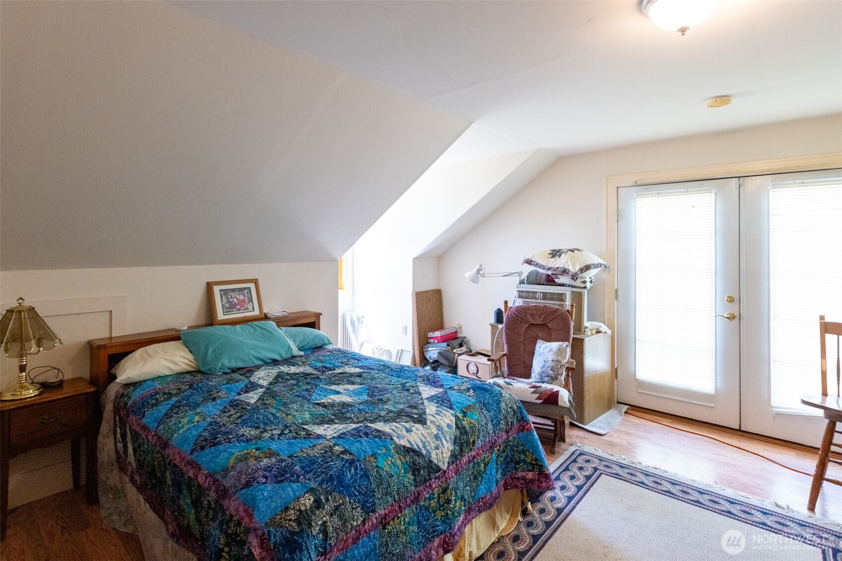 992 Highway 142 Lyle, WA 98635 - Photo 38 of 40 a bedroom with a bed and large windows