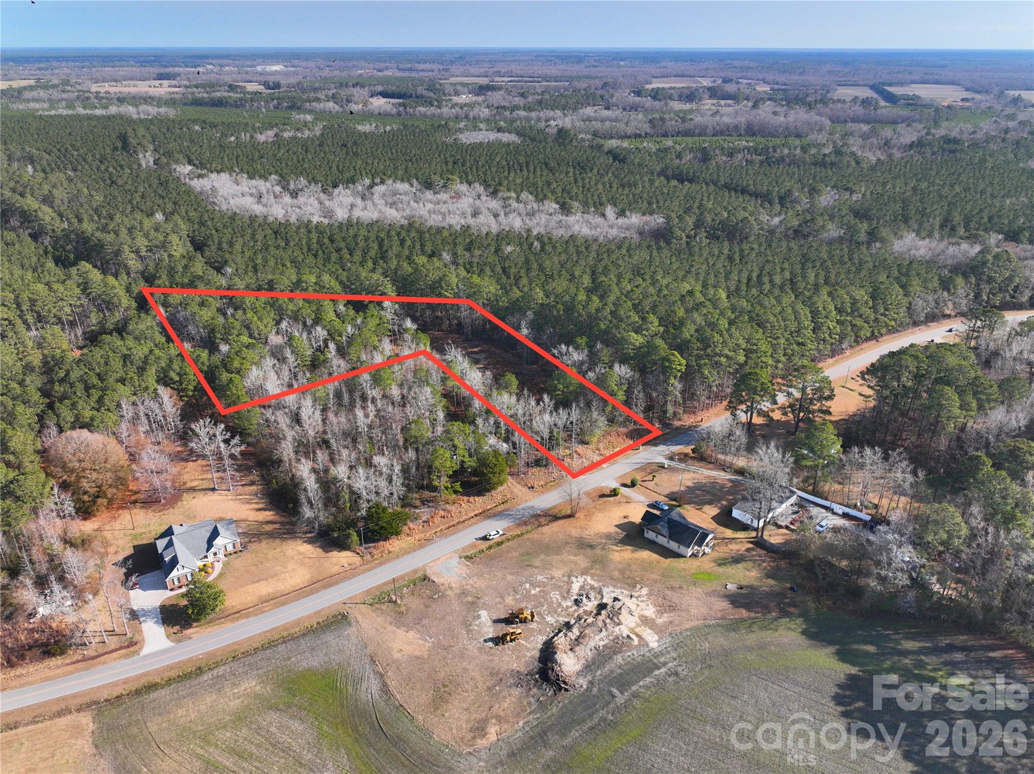 0 Mattocks Road Maysville, NC 28555 - Photo 15 of 25 an aerial view of lake residential house with swimming pool and green space