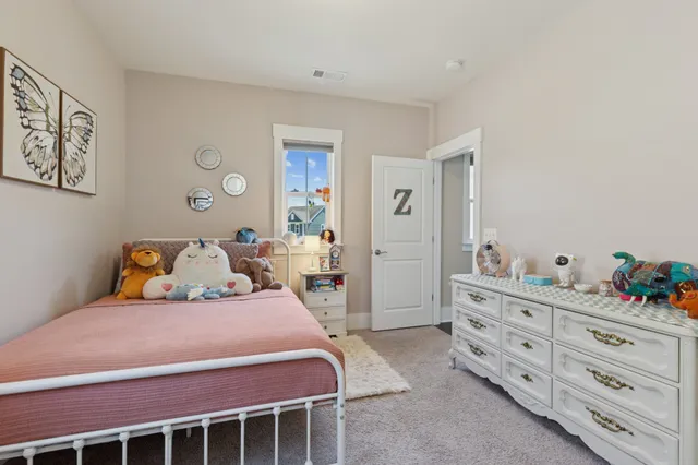 a bedroom with a bed and a cabinets