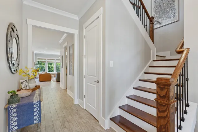 a view of staircase with wooden floor and windows