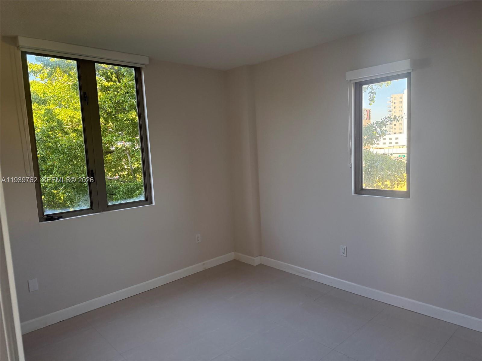 2630 Southwest 28th Street, Unit 47 Miami, FL 33133 - Photo 3 of 7 an empty room with a window