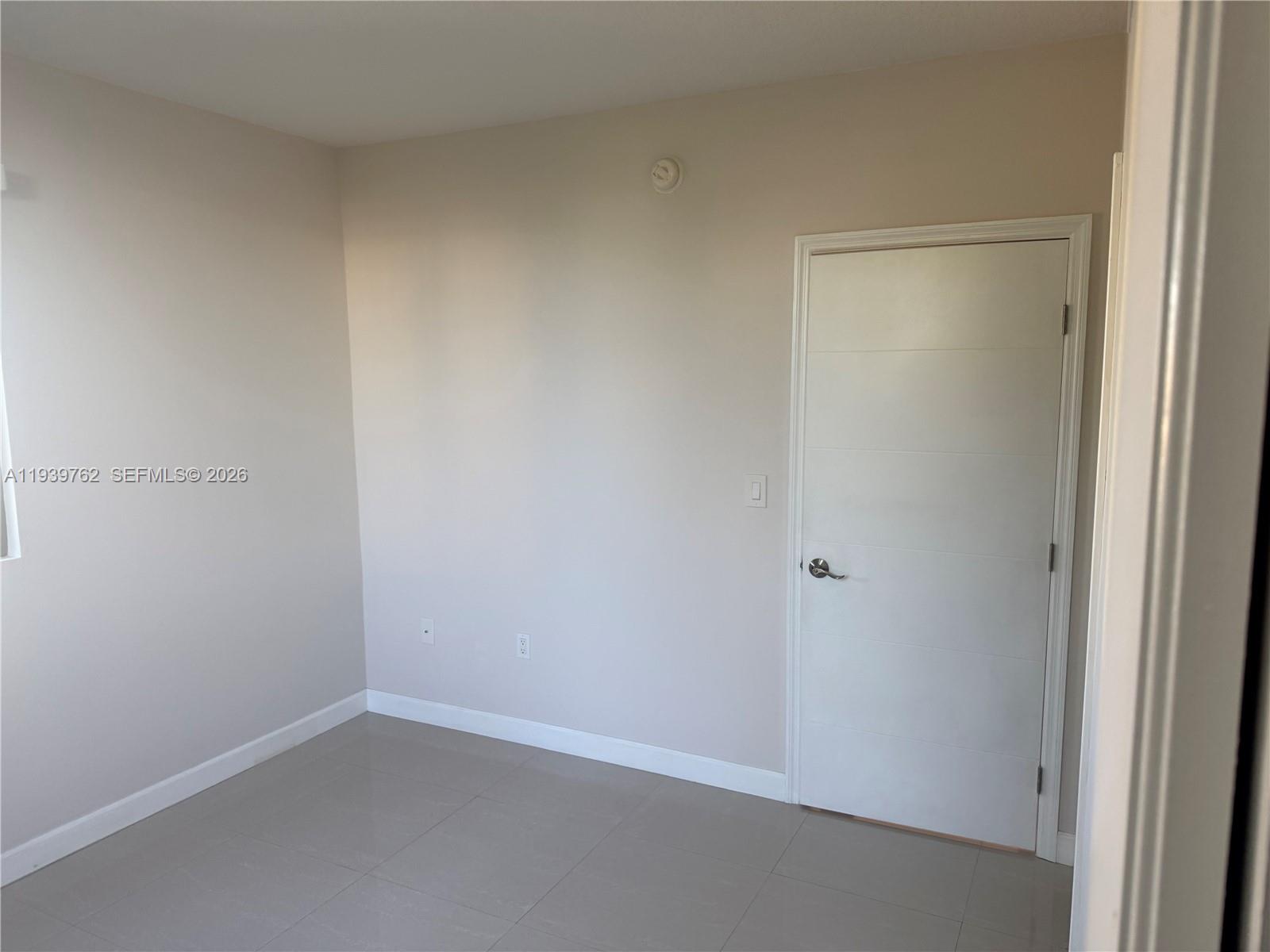 2630 Southwest 28th Street, Unit 47 Miami, FL 33133 - Photo 4 of 7 a room that has a window in it