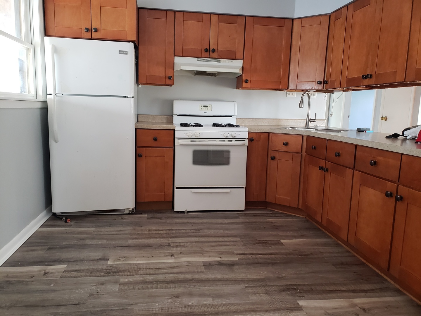 220 West Oneida Avenue Bartlett, IL 60103 - Photo 2 of 11 a kitchen with a white stove top oven and refrigerator