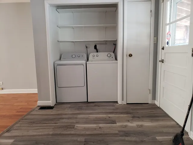 a view of a storage & utility room with washer and dryer