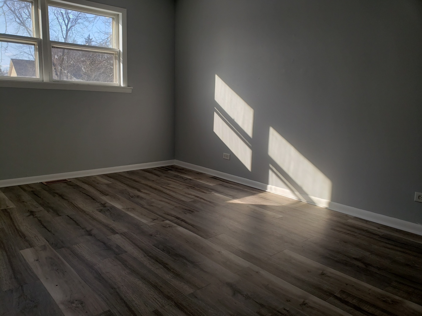 220 West Oneida Avenue Bartlett, IL 60103 - Photo 4 of 11 a view of empty room with wooden floor and fan